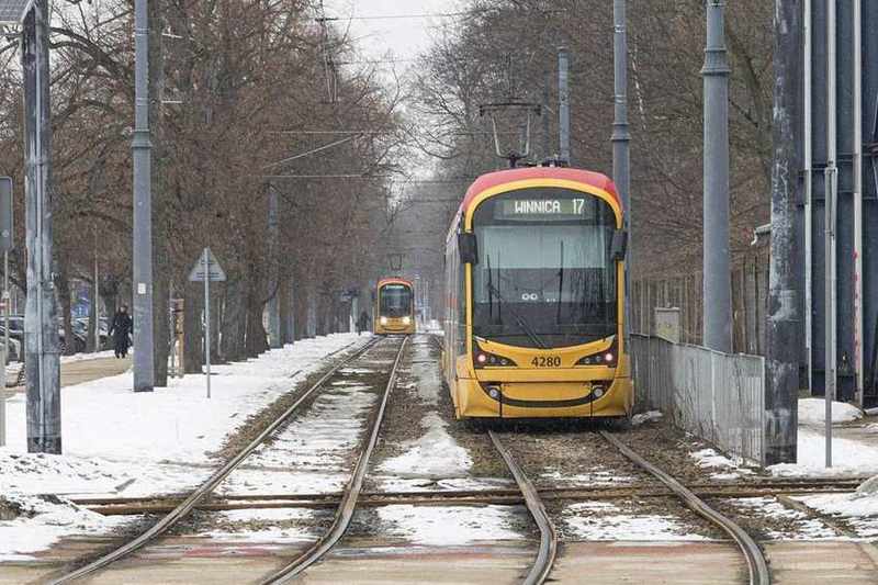 A tram on snowy tracks in Warsaw