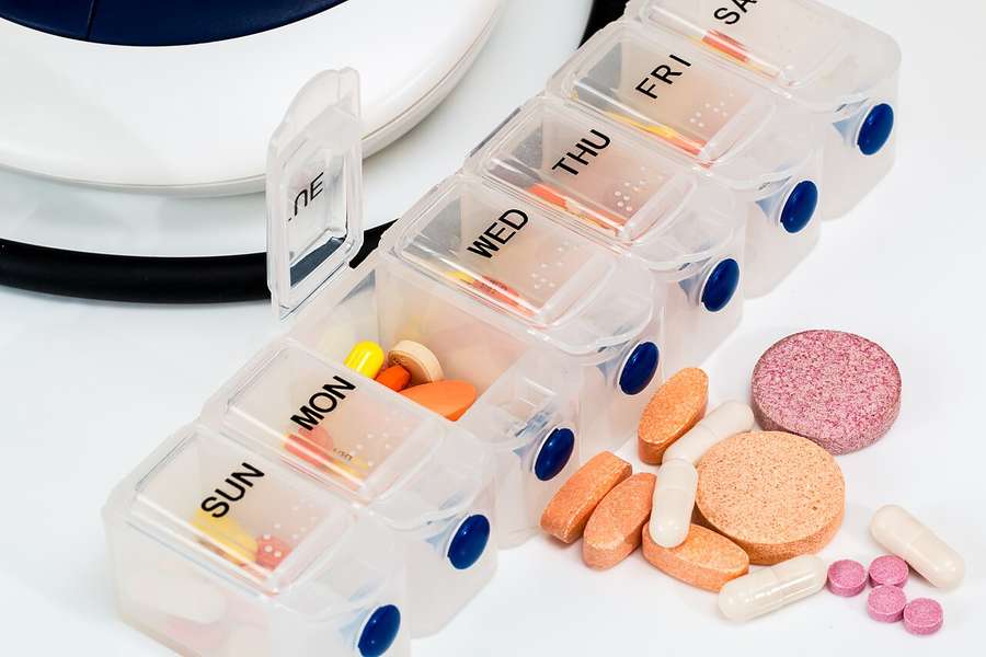 A pill organiser with vitamins and medicines