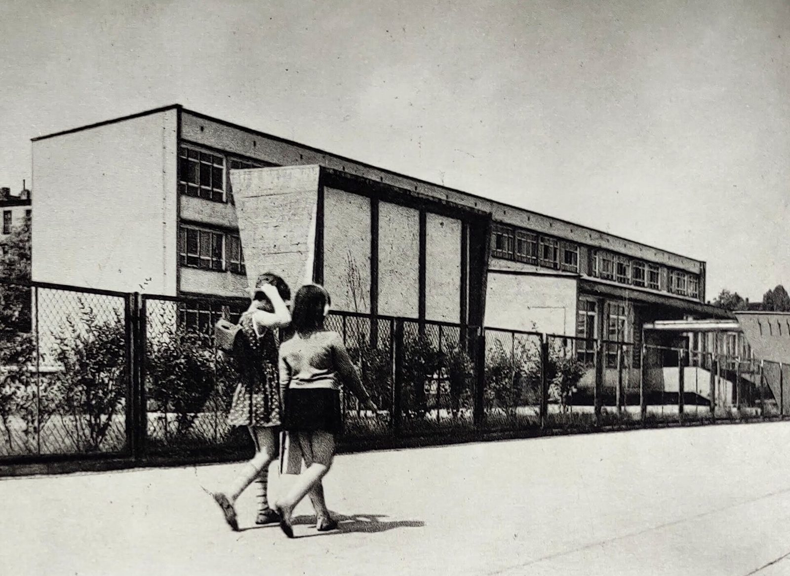 Archive photo of a school building and pupils